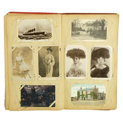 Lot 283 - An Edwardian postcard album, containing a...