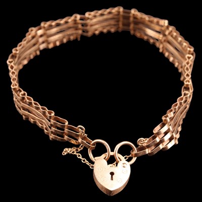 Lot 1004 - A 1980s 9 ct gold gate-link bracelet having a...