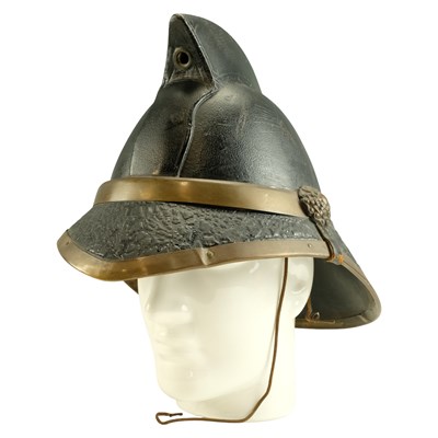 Lot 597 - A 1938 fireman's leather and brass helmet, by...
