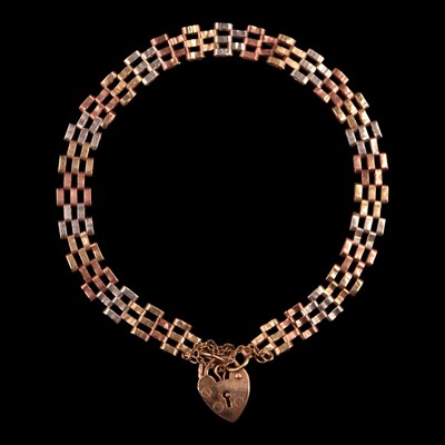Lot 1030 - A 1980s three-colour 9 ct gold gate-link...