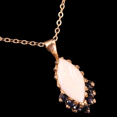 Lot 1013 - A 1970s opal and sapphire pendant suspended on...