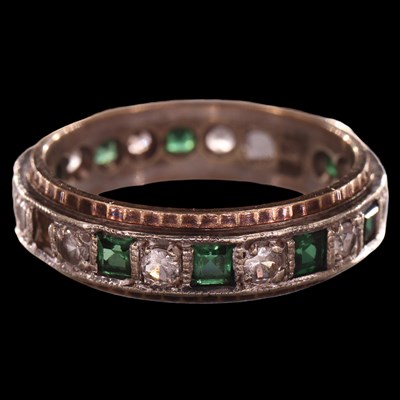 Lot 1019 - A 1970 white sapphire and emerald eternity...