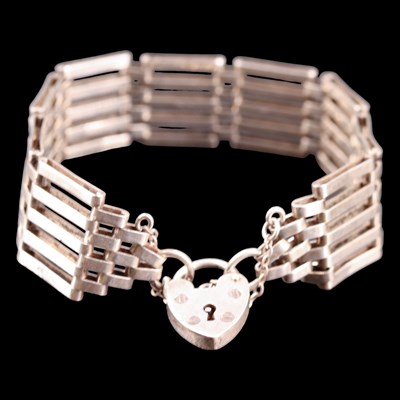 Lot 1032 - A 1980s white metal gate-link bracelet, having...