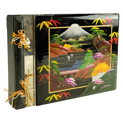 Lot 544 - A Japanese lacquer-decorated clockwork musical...