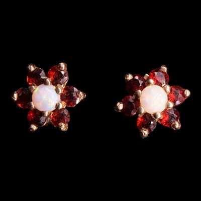 Lot 1026 - A pair of vintage opal and garnet flowerhead...