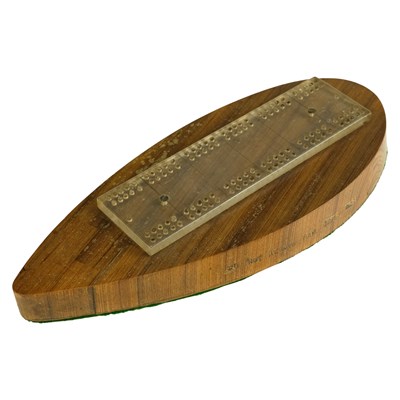 Lot 109 - A cribbage board, in perspex, mounted on a...