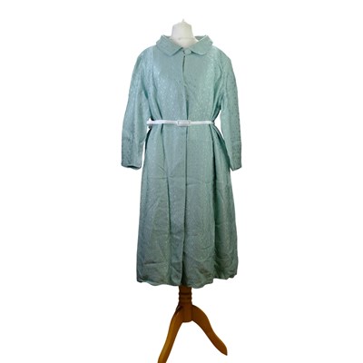 Lot 679 - A turquoise three-quarter length dress...