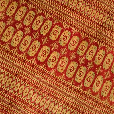Lot 1177 - A traditional Pakistani Bokhara rug, having...