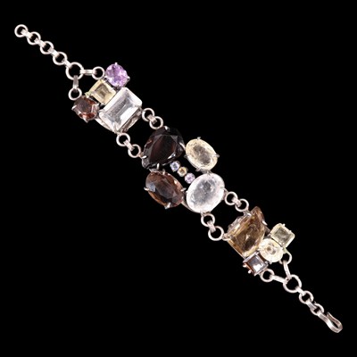 Lot 946 - A bracelet of variously-cut large gemstones...