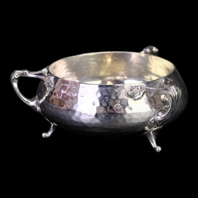 Lot 899 - A 1920s Arts and Crafts influenced silver...