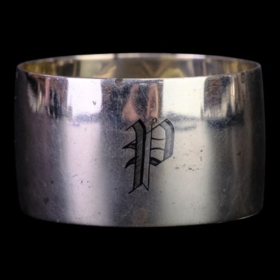 Lot 900 - A Middle Eastern silver and niello napkin ring,...