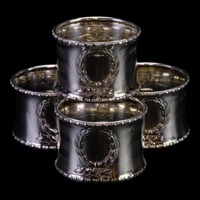 Lot 914 - Four Belle Epoque silver napkin rings, each of...