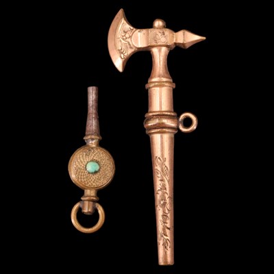 Lot 1074b - A Victorian novelty rolled-gold watch key in...