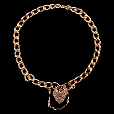 Lot 952K - A 1980s 9 ct gold curb-link bracelet with a...