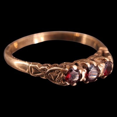 Lot 952F - A vintage three-stone garnet ring, comprising...