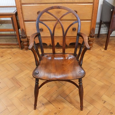 Lot 1196 - An early 19th Century Gothic Windsor armchair,...