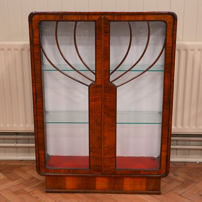 Lot 1204 - An Art Deco influenced figured walnut display...