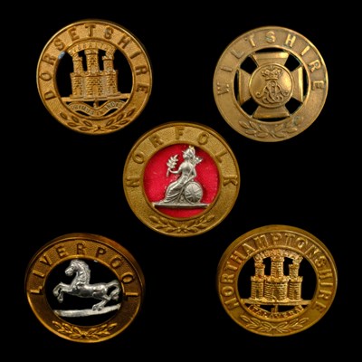 Lot 64 - Five various other ranks' helmet plate centres