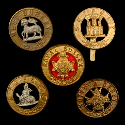 Lot 68 - Five various other ranks' helmet plate centres