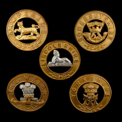 Lot 70 - Five various other ranks' helmet plate centres