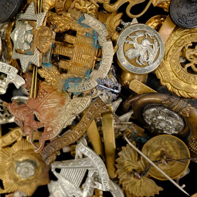Lot 80 - A group of British military cap badges,...