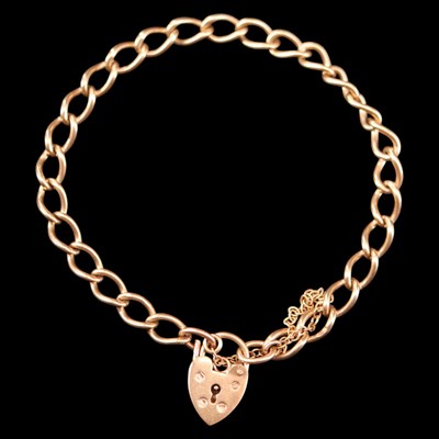 Lot 1310 - A 1970s 9 ct gold curb-link bracelet having a...
