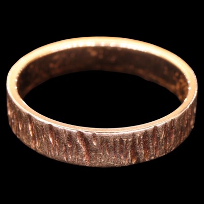 Lot 1362 - A vintage bark-textured 9 ct gold band, P/Q, 2....