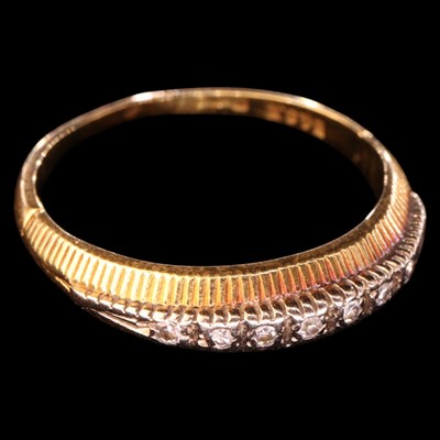 Lot 1367 - A vintage diamond ring, comprising a row of...