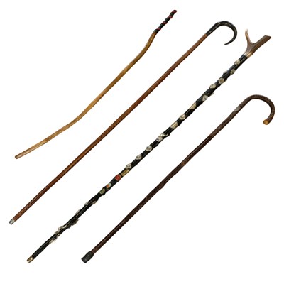 Lot 676 - A group of four walking sticks, including an...