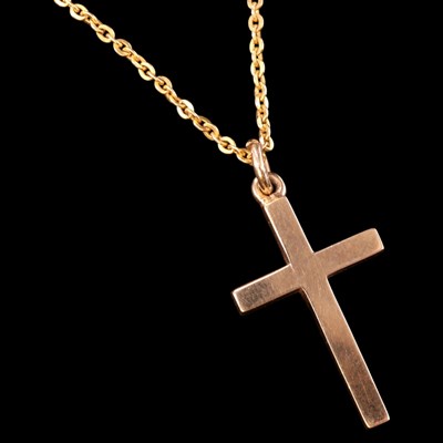 Lot 1376 - A 1960s 9 ct gold pendant cross, on a fine...