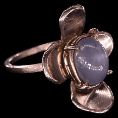 Lot 1377 - A contemporary artisanal star sapphire and 18...