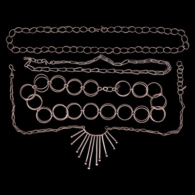 Lot 1380 - Four Modernist artisanal silver necklaces,...