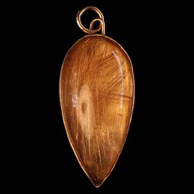 Lot 1381 - A rutilated quartz pendant, the inverted...