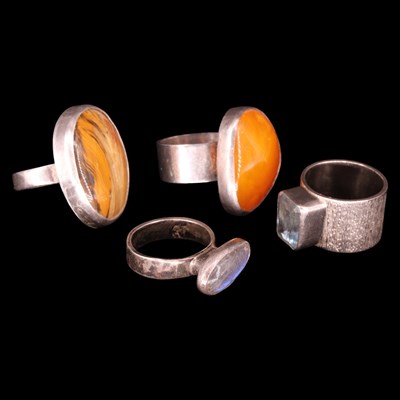 Lot 1388 - Four Modernist artisanal silver / white metal...