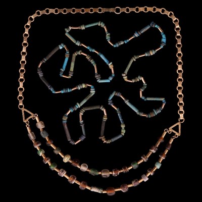 Lot 1400 - A Roman glass bead and gilt white-metal...