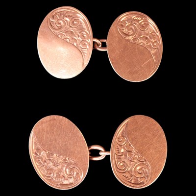 Lot 1404 - A pair of 1920s 9 ct rose-gold oval cufflinks,...