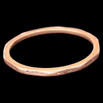 Lot 1407 - A 1950s slender facetted 9 ct gold wedding...