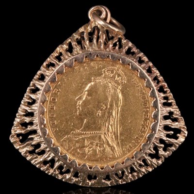 Lot 1070 - An 1887 gold sovereign coin mounted in a 9 ct...
