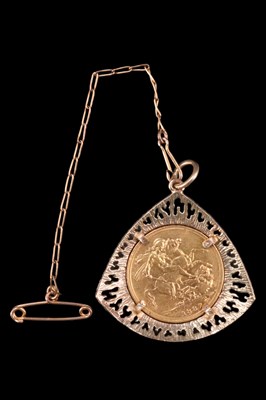 Lot 1070 - An 1887 gold sovereign coin mounted in a 9 ct...
