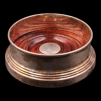 Lot 1166 - A near-contemporary silver wine bottle coaster,...