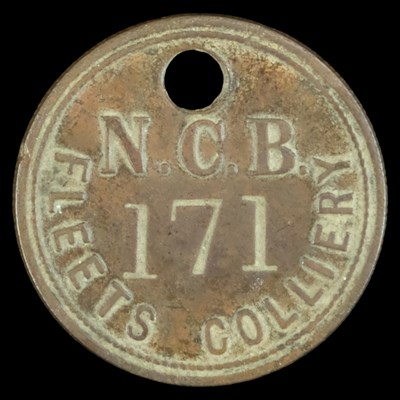 Lot 557 - A Fleetus Colliery miner's tally check,...