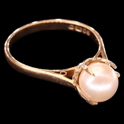 Lot 1450 - A 1980s pearl solitaire ring, comprising a...