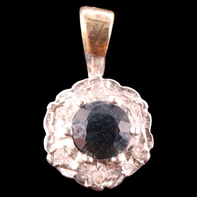Lot 1453 - A 1980s sapphire and diamond cluster...