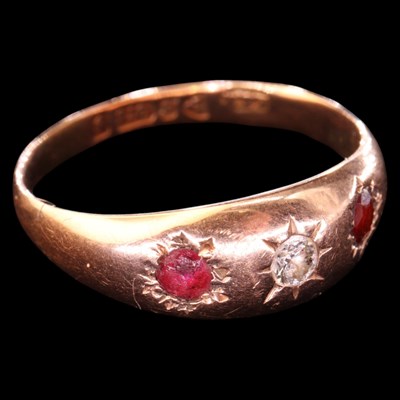 Lot 1455 - An Edwardian diamond and garnet three-stone...