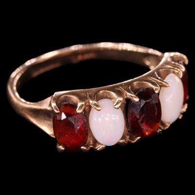 Lot 1459 - A 1970s opal and garnet five-stone...