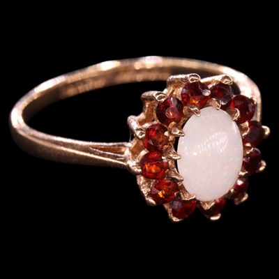 Lot 1460 - A 1970s opal and garnet cluster...