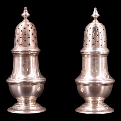 Lot 1184 - A pair of 1930s silver pepperettes, Willim...
