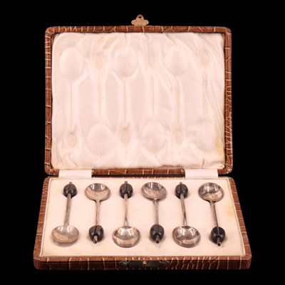 Lot 1169 - A 1920s set of six silver coffee spoons having...