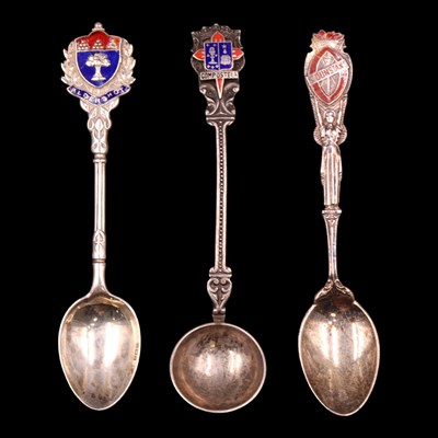 Lot 1179 - Three silver / white metal souvenir spoons,...