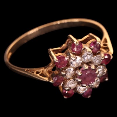 Lot 1470 - A 1980s ruby and white gemstone flowerhead...